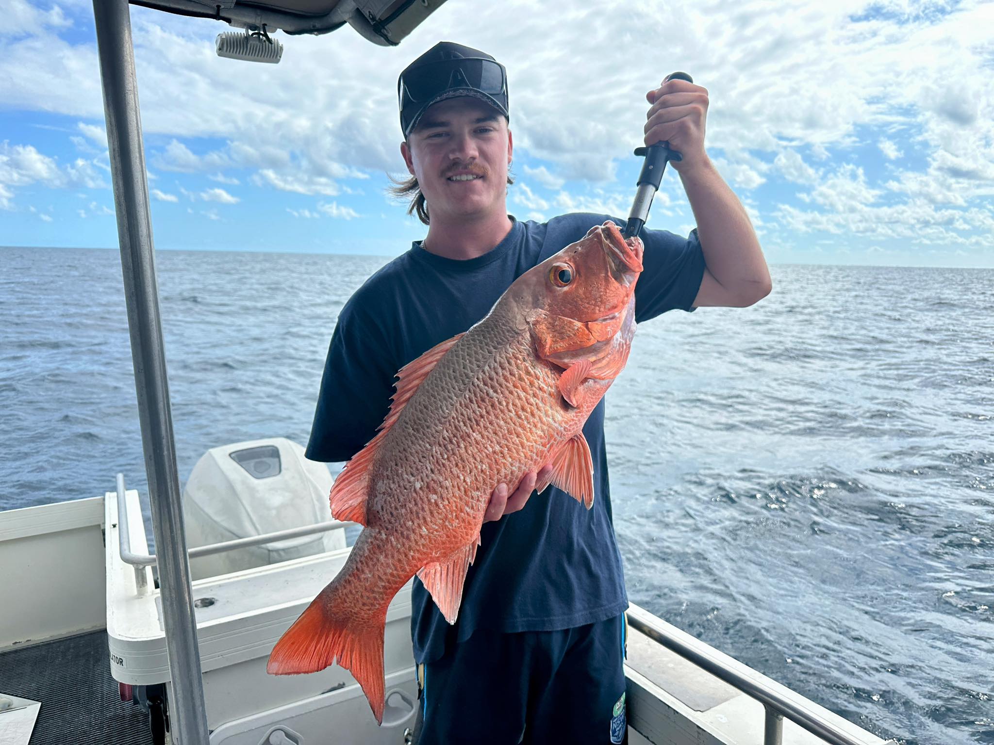 Filleting a fresh coral trout