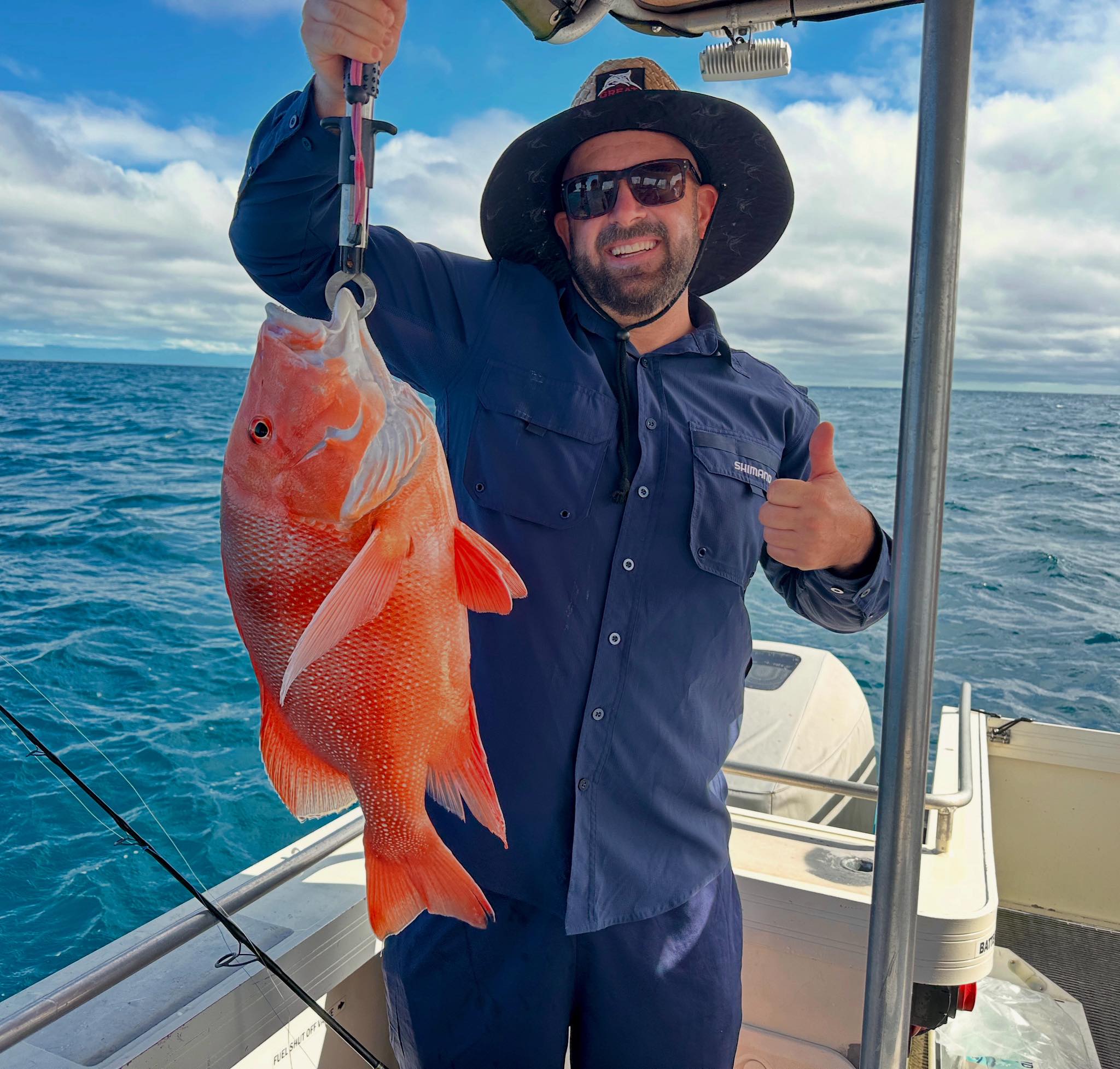 Happy angler with their reef fish catch