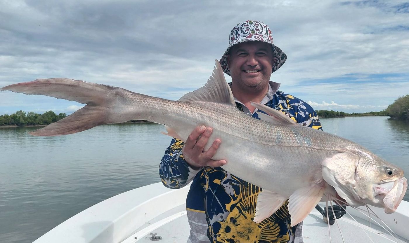 Angler holding a king threadfin
